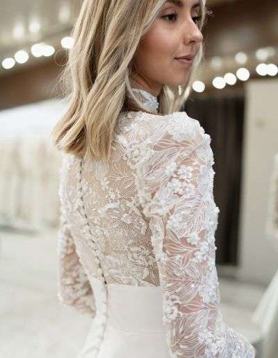 modest lace wedding dress with long sleeves and buttons