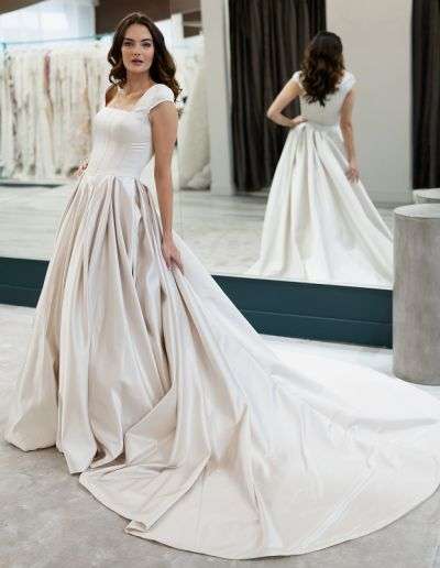 Satin modest bridal dress with cap sleeves and train