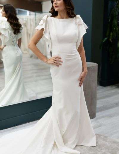 fitted modest bridal dress with flutter sleeves and bows