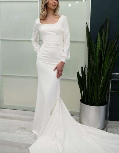 modest fitted wedding dress with long sleeves and beading
